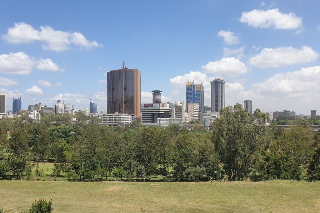 The Nairobi central business district skyline seen across open parkland in Kenya