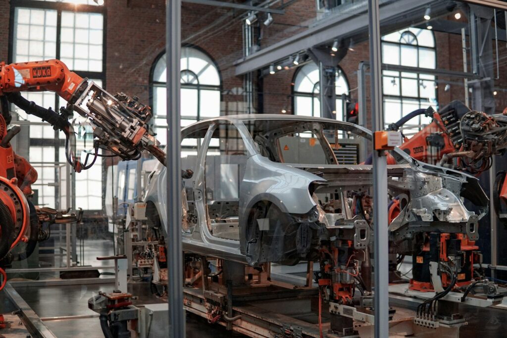 Robotic arms welding on an automated vehicle manufacturing assembly line